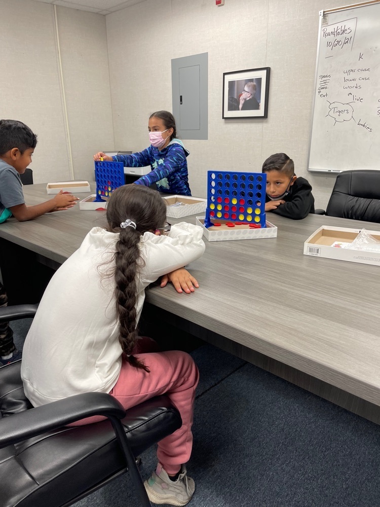 students playing Connect Four