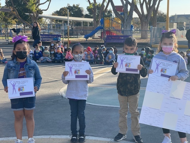 First Grade Students getting their awards for placing in the Connect Four Tournament